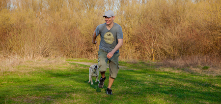 The man trains the dog. Educating dog. Play with a pet. Dog handler.の写真素材
