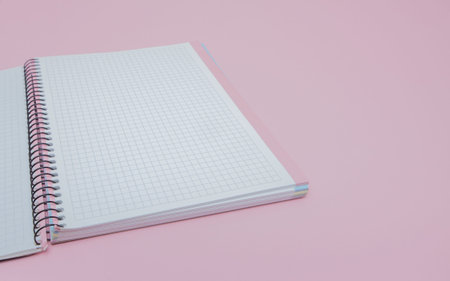 Notebook on pink background, lifestyle concept, top view