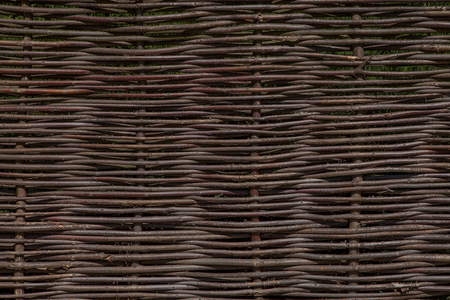 Wooden brown texture of thin rural fence rods.の写真素材