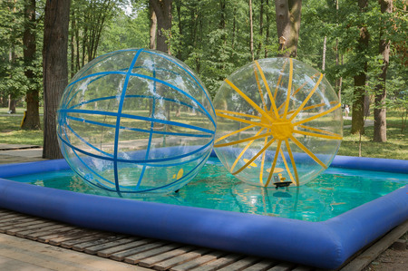 Actraction large balls in the pool in the park.の写真素材