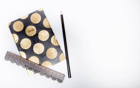 Pencil And Ruler On Notebook. Pencil and ruler on notebook with copy space on white background.の写真素材
