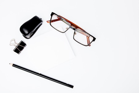 Stationary concept, Flat Lay top view Photo of pencil, stapled, paper clips, eyepieces, notes on white background with copy space.の写真素材