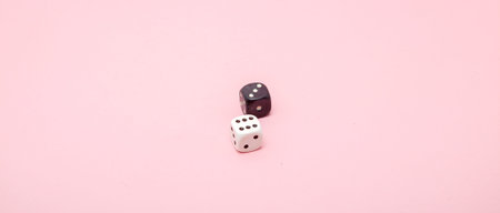 The playing bones are white and black.Casino, gambling and fortune concept.