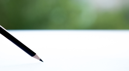 Close up of pencil writing on paper. Macro with extremely shallow depth of field.の写真素材