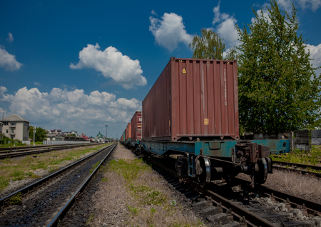 Container loaded on train wagons on a railway.の写真素材