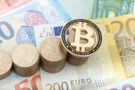 Financial growth concept. Histogram with coins and Bitcoin in euro background. Photo new virtual money.の写真素材