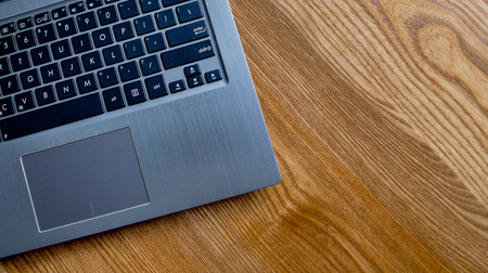 Office desk table with laptop computer. Top view with copy space.の写真素材