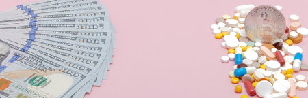 Bitcoin, Dollars and pills on a pink background. Prescription medicine on dollars for pharmaceutical...