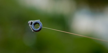 Fishing rod rings close up with blurred background.の写真素材