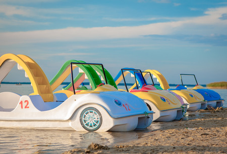 Colorful sail catamarans on the beach.の写真素材