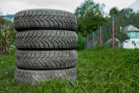 Winter tires close-up . Tires on green background.の写真素材