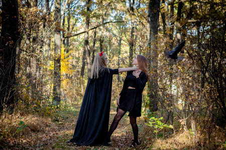 Halloween demon and witch in the woods.