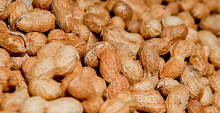 Peanuts in shell texture background. Raw peanuts on display at a farmer's market.