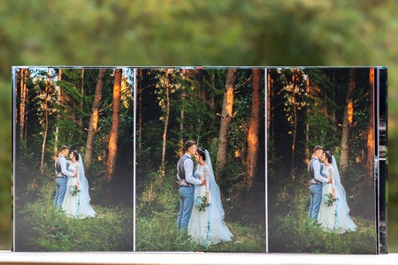 Pages of wedding photobook or wedding album on green background.の写真素材