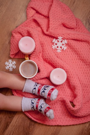Tasty coffee or cocoa on a wooden background and pink tablecloth.の写真素材