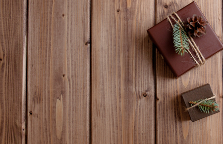Vintage gift box with bow on wooden background copy space.の写真素材