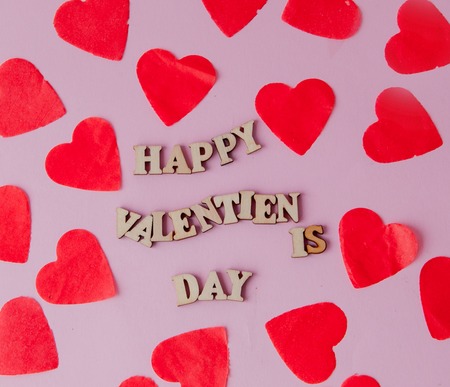 Many hearts with an inscription Happy Valentines Day on a pink background.. Background for a greeting card for Saint Valentines Festive concept for Valentines day, Mothers day or birthdayの写真素材