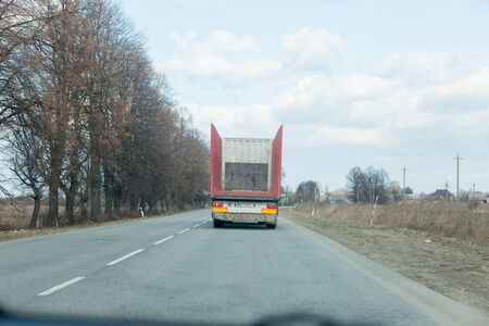 Kyiv, UKRAINE- March 06, 2019:Large truck for transporting wood on the road.のeditorial素材