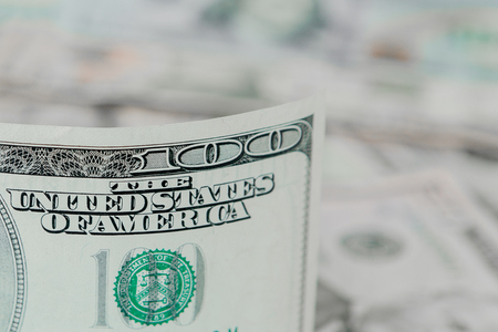 Money colorful background close-up. Details of American national currency banknotes bills. Symbol of wealth and prosperity. Cash, busyness and finances concept.の写真素材