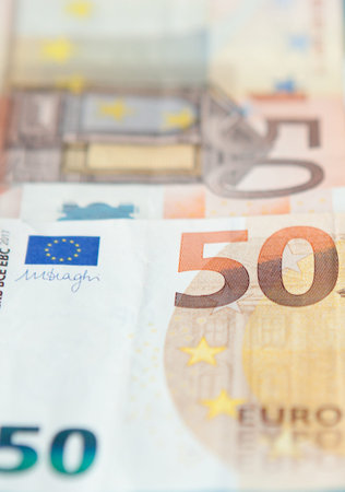 Closeup of a group of fifty euros banknote background.