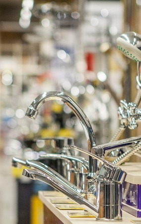 showcase in the store with faucets for the kitchen and bathroom.の写真素材