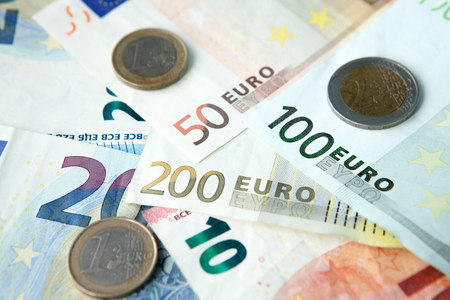Euro banknotes and coins background . Money and finances conceptの写真素材