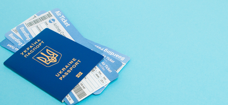 Passport and air tickets on a blue background. mockup empty blank, copy space.の写真素材