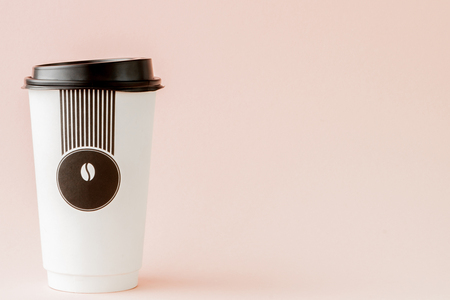 Take-out coffee in thermo cup on a pink background, Copy space.の写真素材