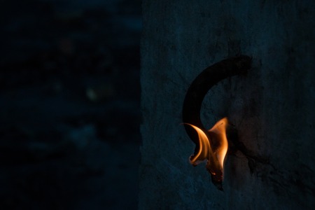 Short circuit, burnt cable, on color wooden background.の写真素材