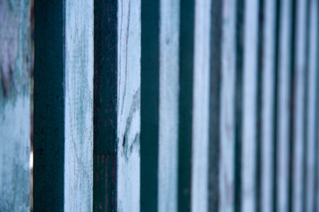 Blue texture of a board with peeling paint. Abstract background for design. Table or wall panel.