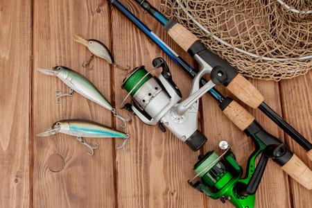 Fishing tackle - fishing spinning, hooks and lures on the  woodの写真素材