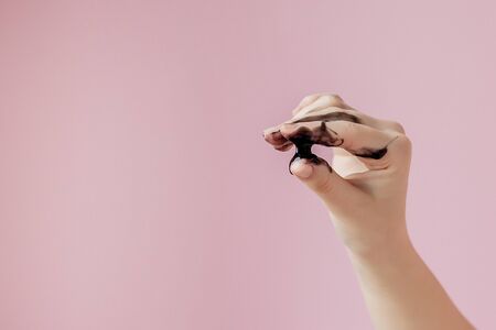 Beauty Cosmetic Peeling. Closeup Beautiful Young Female With Black Peel Off Mask On Skin. Closeup Of Attractive Woman With Cosmetic Skin Care Peeling Product On Face. High Resolution.の写真素材