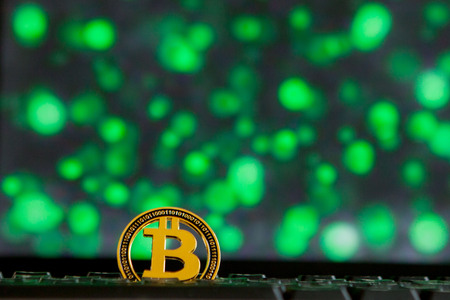 Bitcoin currency on keyboard computer on bokee background.Virtual cryptocurrency conceptの写真素材
