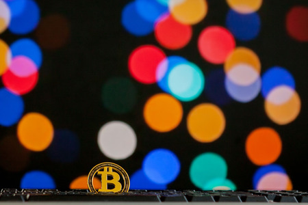 Bitcoin currency on keyboard computer on bokee background.Virtual cryptocurrency conceptの写真素材
