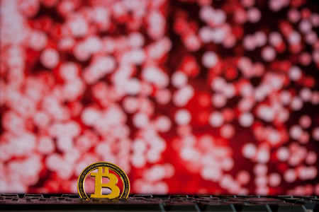 Bitcoin currency on keyboard computer on bokee background.Virtual cryptocurrency conceptの写真素材