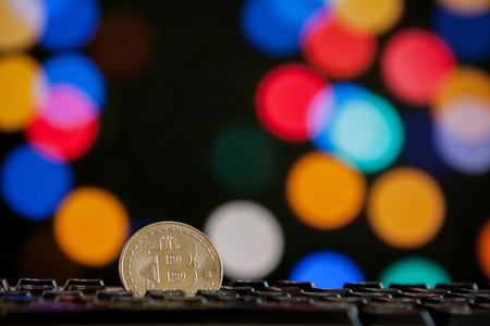 Bitcoin currency on keyboard computer on bokee background.Virtual cryptocurrency conceptの写真素材