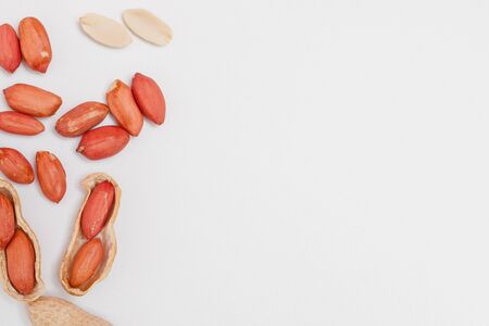 Large peeled peanuts close-up of beans in the shell. Unpeeled peanuts in the shell. Peanuts, for background or texture. Growing organic protein.の写真素材