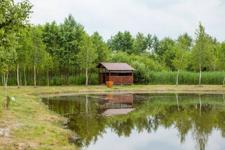 Holiday house near the lake. The concept of fishing and recreation.の写真素材