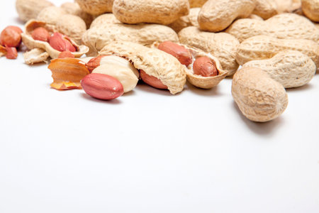 Large peeled peanuts close-up of beans in the shell. Unpeeled peanuts in the shell. Peanuts, for...