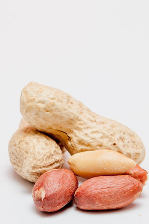 Large peeled peanuts close-up of beans in the shell. Unpeeled peanuts in the shell. Peanuts, for...