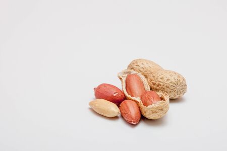 Large peeled peanuts close-up of beans in the shell. Unpeeled peanuts in the shell. Peanuts, for background or texture. Growing organic protein.の写真素材