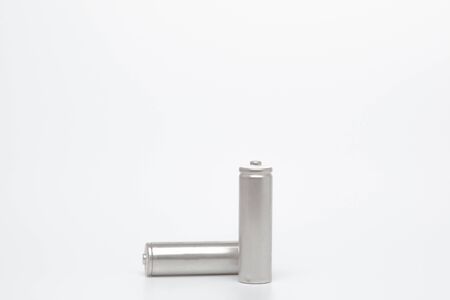 Close up grey AA batteries over white background with clipping path.の写真素材