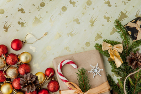Christmas gift box, food decor and fir tree branch on wooden table. Top view with copy space.