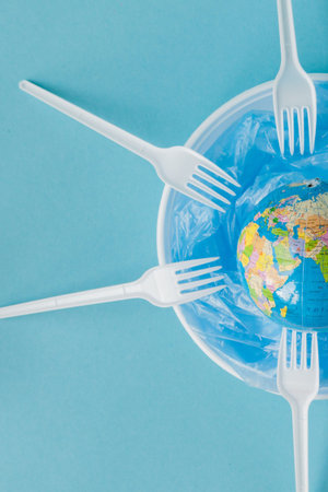 Globe on a plastic plate. The concept of ecology, land conservation.の写真素材