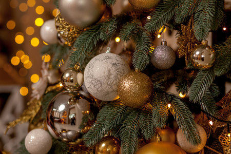 Decorated Christmas tree on blurred, sparkling and fairy background.
