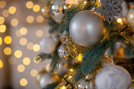 Decorated Christmas tree on blurred, sparkling and fairy background.