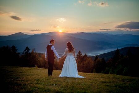 Bride and Groom at Sunset Romantic Married Couple.の写真素材