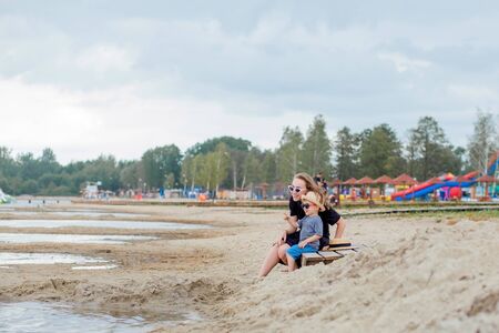 Mother and her cute little son enjoying time at beach.の写真素材