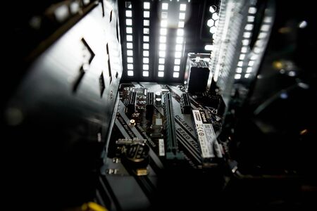Kyiv, Ukraine - August 17, 2019: Inside of the personal computer power supply motherboard, cables, discs, fan PC serviceのeditorial素材