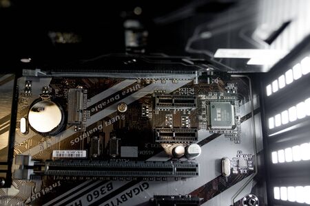 Kyiv, Ukraine - August 17, 2019: Inside of the personal computer power supply motherboard, cables, discs, fan PC serviceのeditorial素材